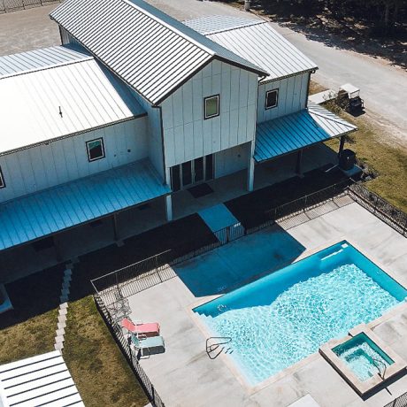 aerial view of clubhouse with pool